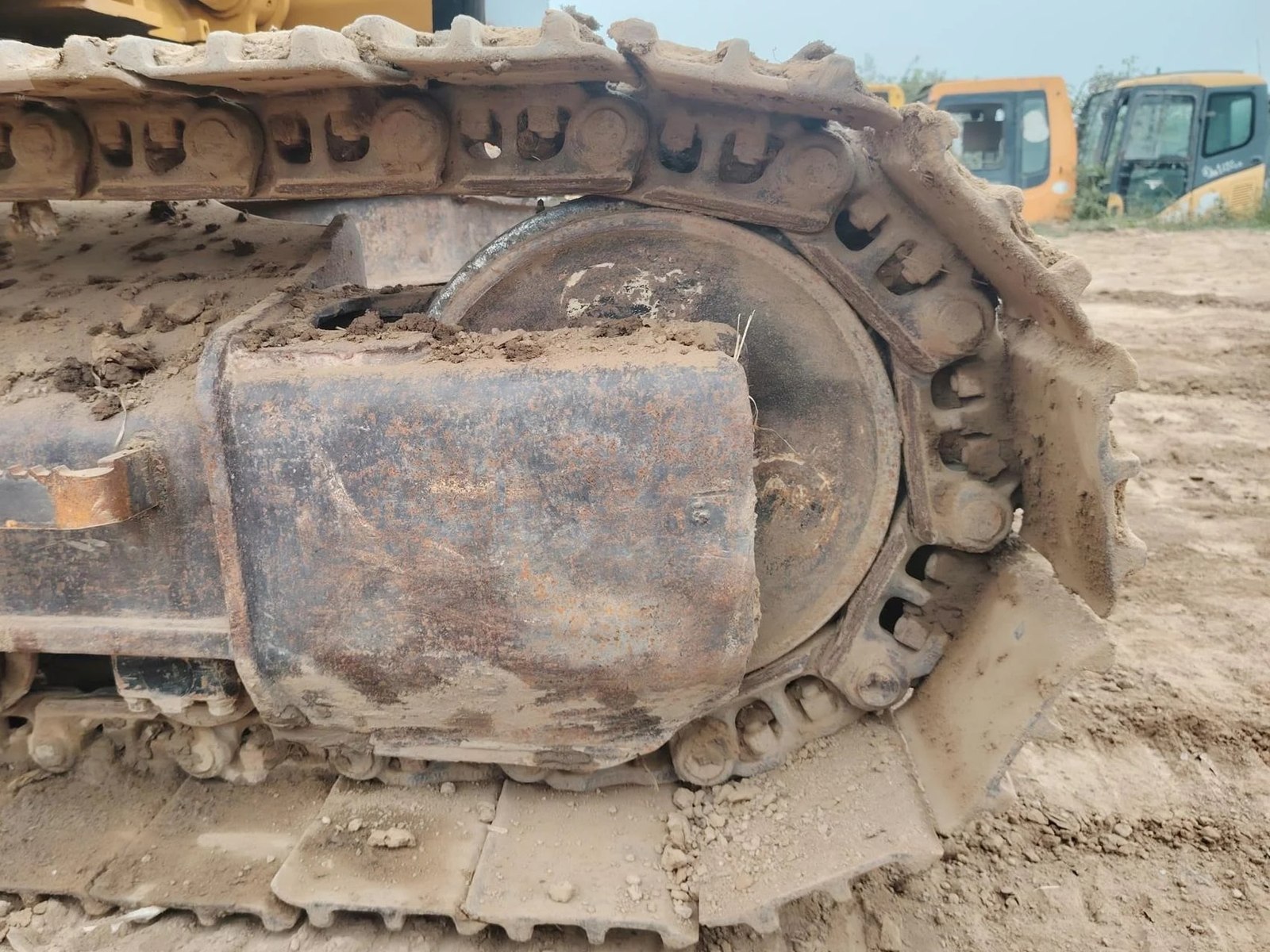 Worn excavator idler wheel, field photo