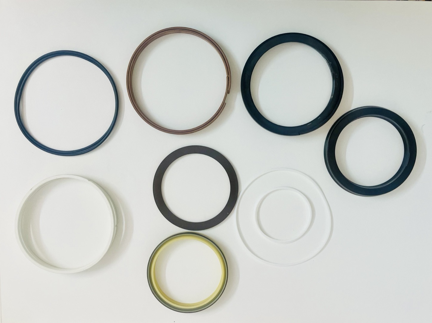 Excavator bucket cylinder seal kit components: O-rings, rod seals, piston seals, wiper seals and backup rings